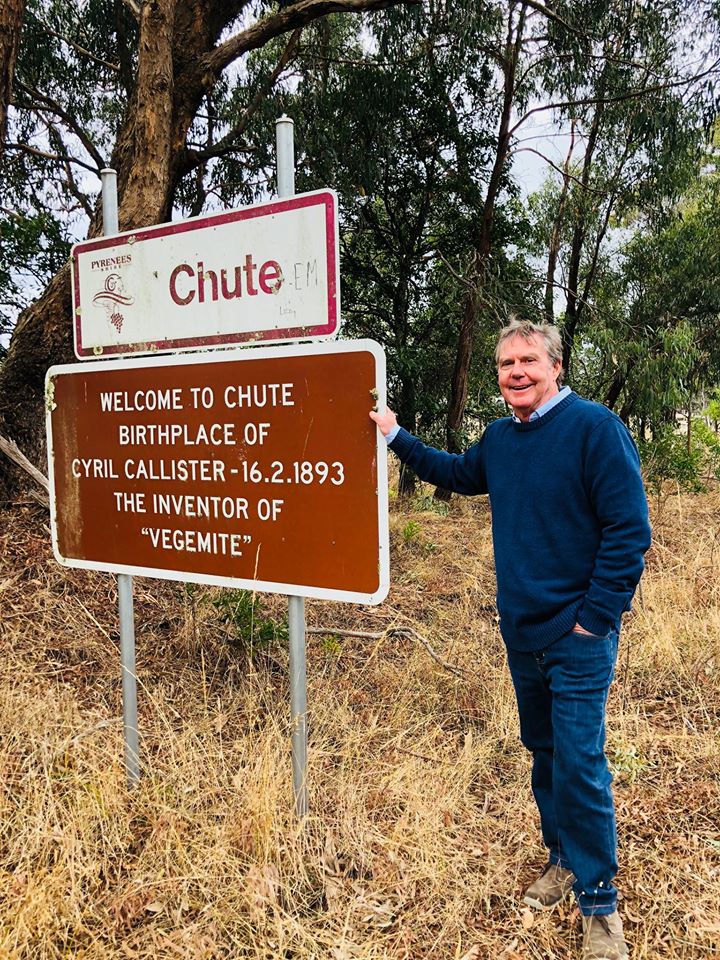 Jamie Callister, grandson of Vegemite inventor Cyril Callister, standing alongside the Chute sign marking the brithplace of vegemite. 